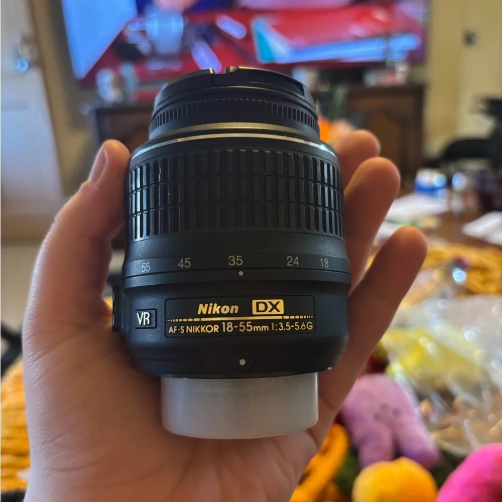 Nikon Black Camera Lens AF-S DX NIKKOR 18-55mm and the second one is a Af-P
